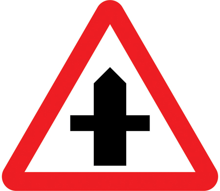 UK crossroads warning sign: a red-bordered triangle showing a crossroad layout.