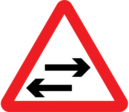 UK two-way traffic crossing sign: a warning triangle with two horizontal arrows pointing in opposite directions.