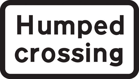 Crossing on road hump ahead sign
