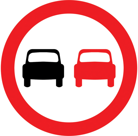 UK no overtaking sign: a red circle containing a red car alongside a black car.