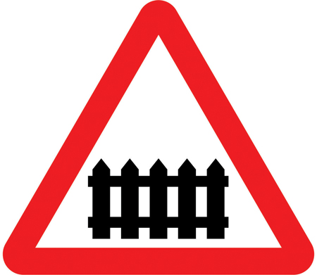 UK warning triangle showing a level crossing with a gate or barrier ahead.