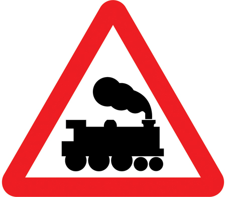 UK warning triangle showing a railway level crossing without a gate or barrier ahead.